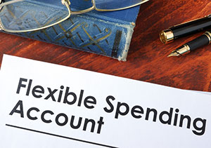 Pair of eye glasses looking at an eye chart