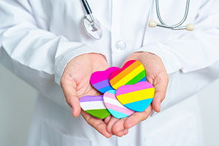 Doctor holding many colorful hearts