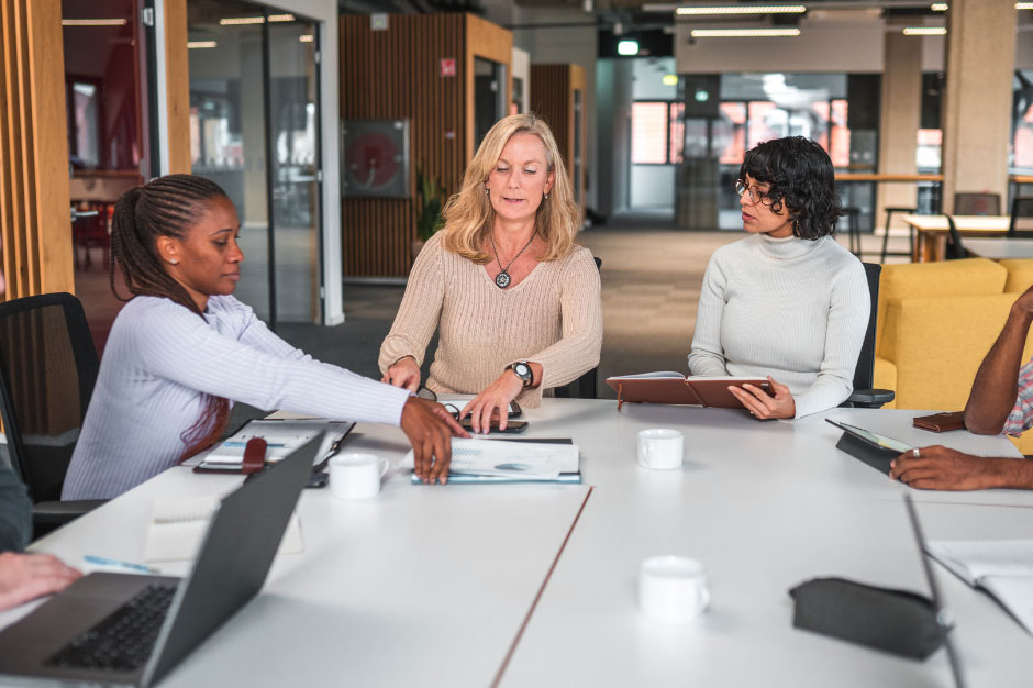 Group of employees sitting at a conference table