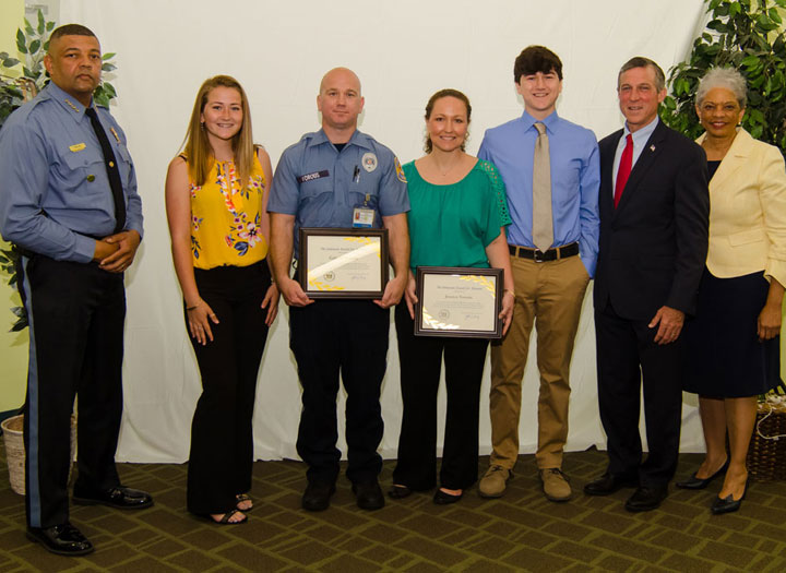 Probation and Parole Officer Jessica Vorous, Correctional Officer Gabe Vorous, and their two children