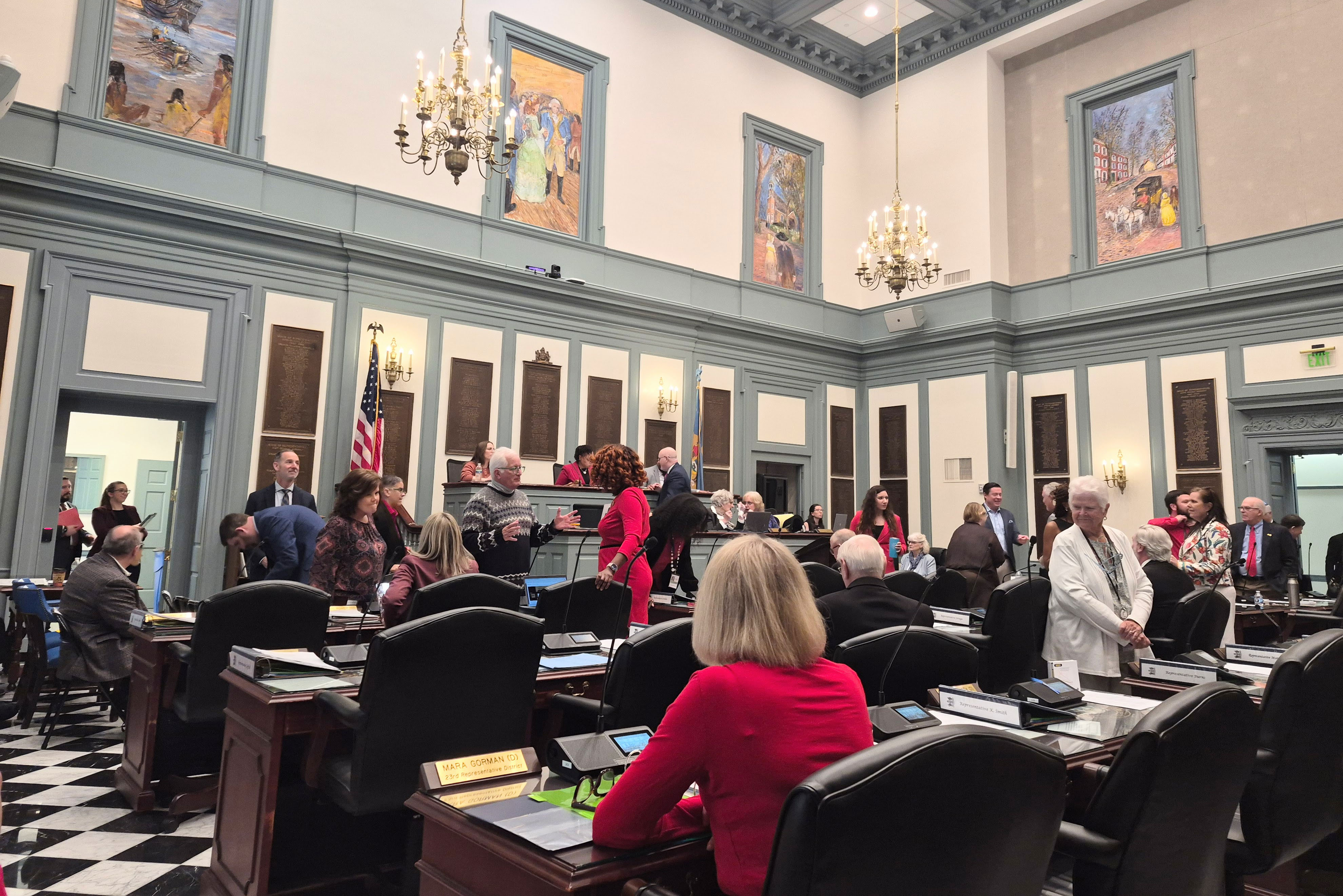 Legislators and other people in Legislative Hall preparing for Equity Day.