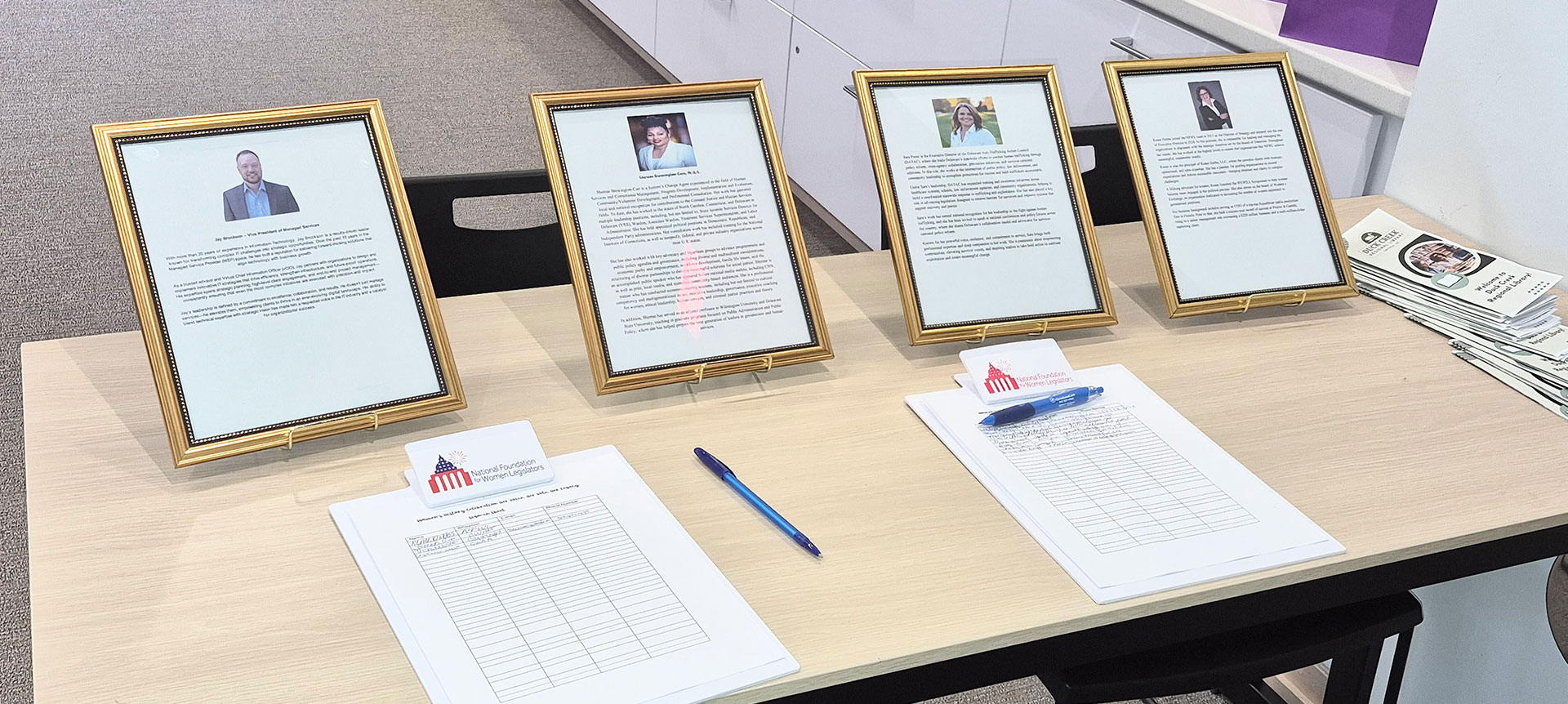 Framed information about the four speakers at the National Foundation for Women Legislators event.