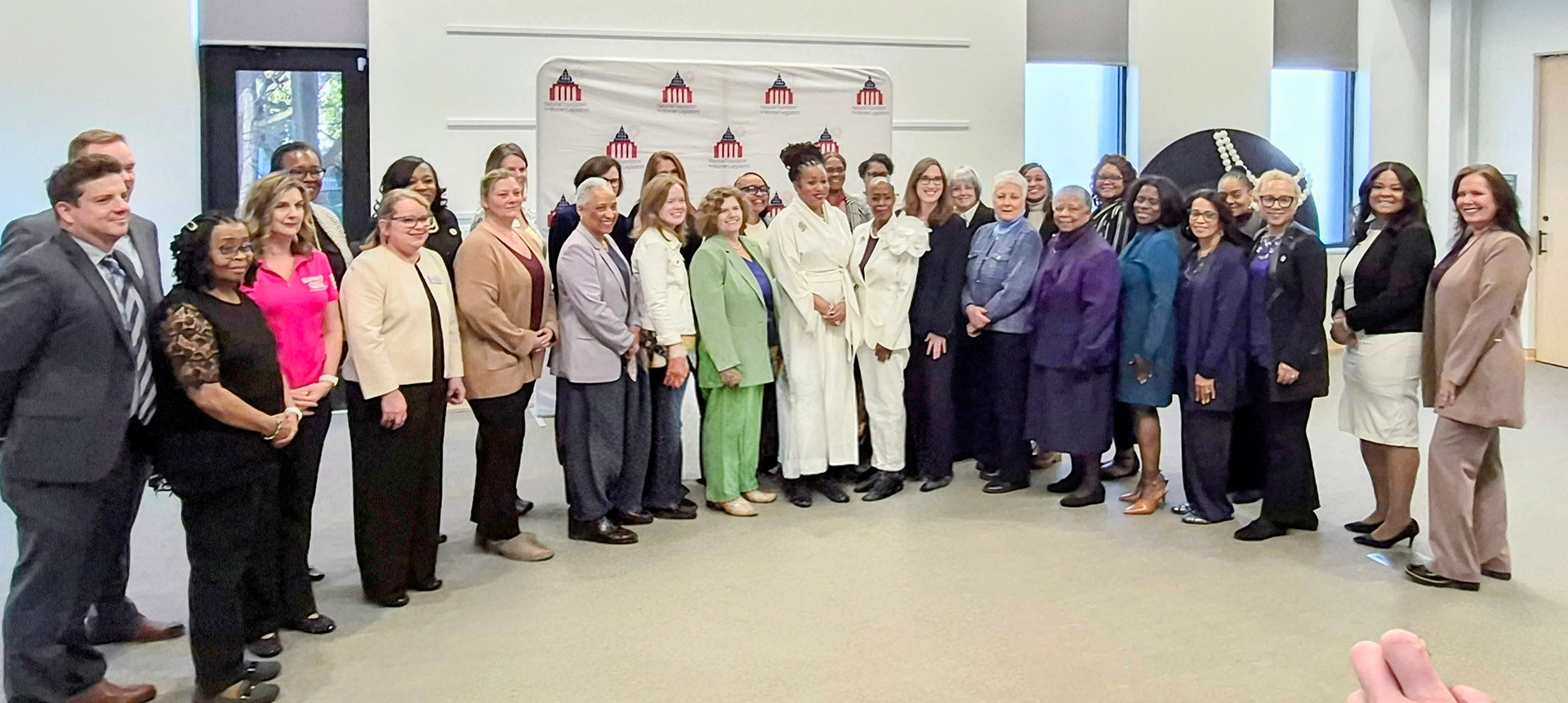 A group of people attending the National Foundation for Women Legislators event.