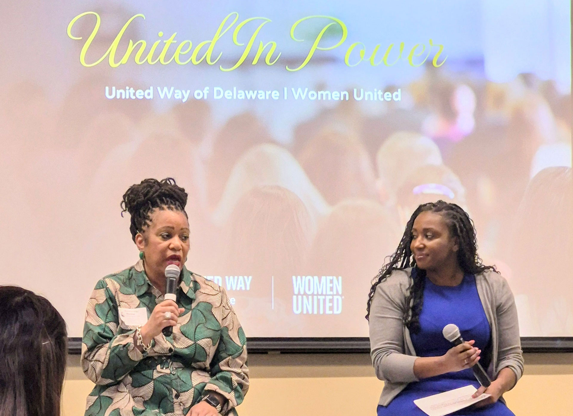 Office of Women's Advancement and Advocacy Executive Director Sherese Brewington-Carr and a United Way representative speaking at the Women United in Power event.