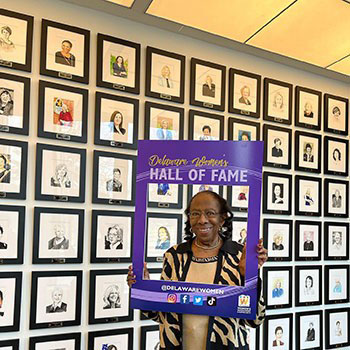 Women showcasing the Delaware Women's Hall of Fame.